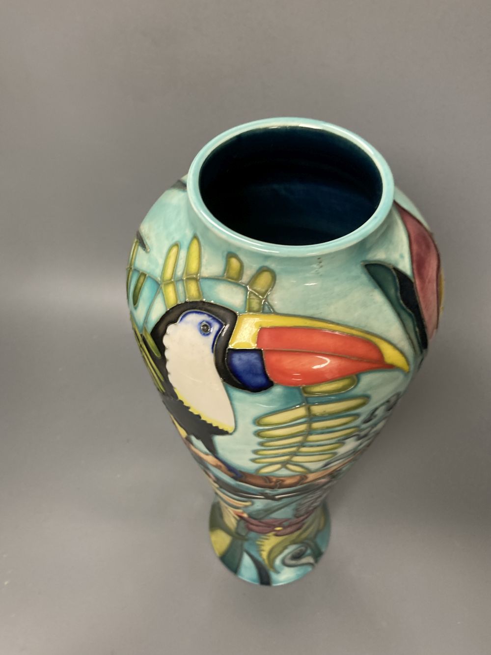 A Moorcroft vase, Jaraqui pattern, designed by Jeanne McDougall, limited edition number 18 of 250, height 37cm, together with origi